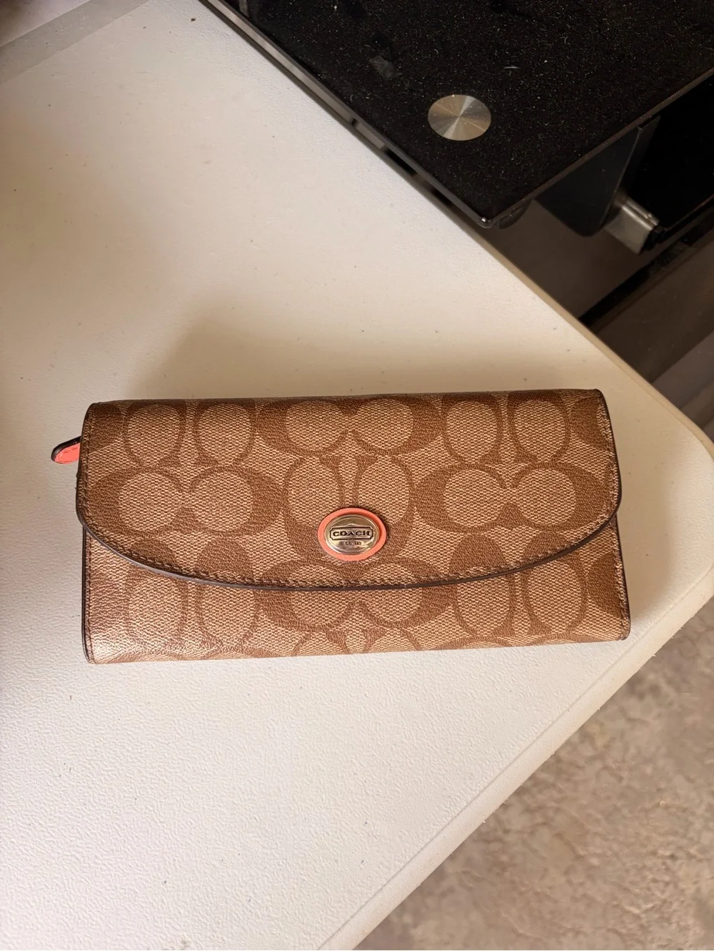 Coach Monogram Continental Wallet in Brown with Coral Accent
